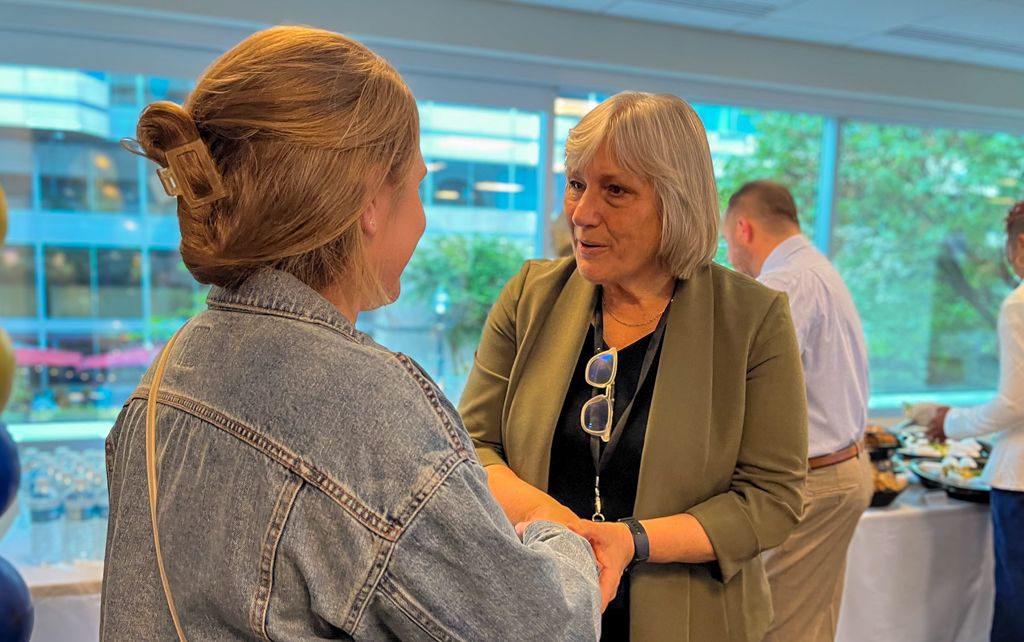 DHSc program director shaking students hand